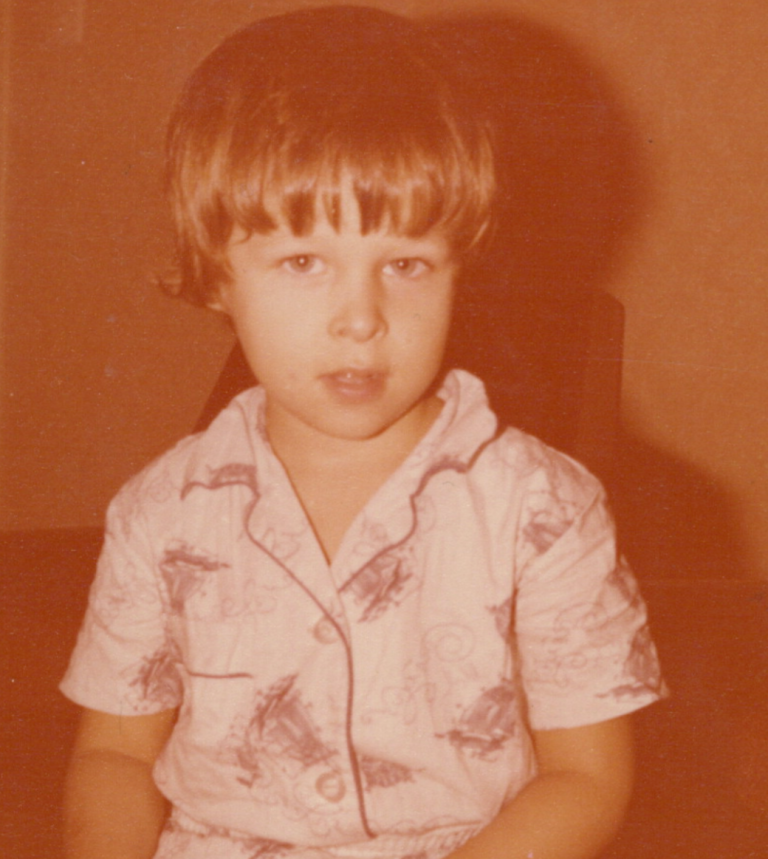 Faded photograph of Michael as a young boy.